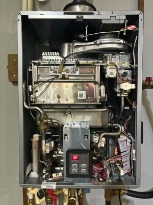The innards of this Rinnai tankless water heater show that tankless water heater repair is a complicated task