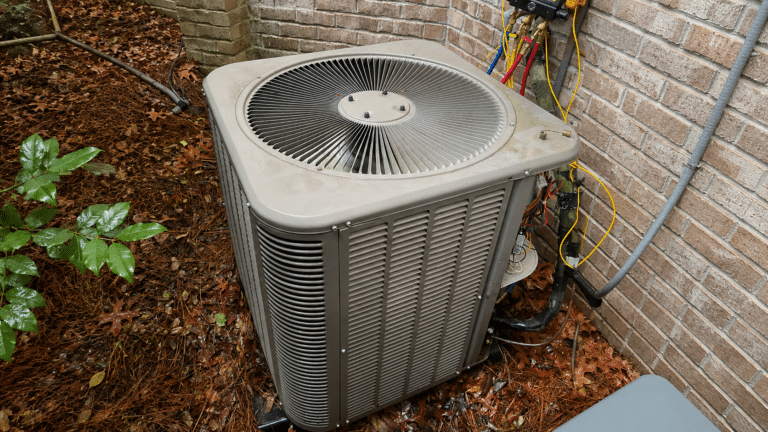 aaron heating and cooling servicing an air conditioner