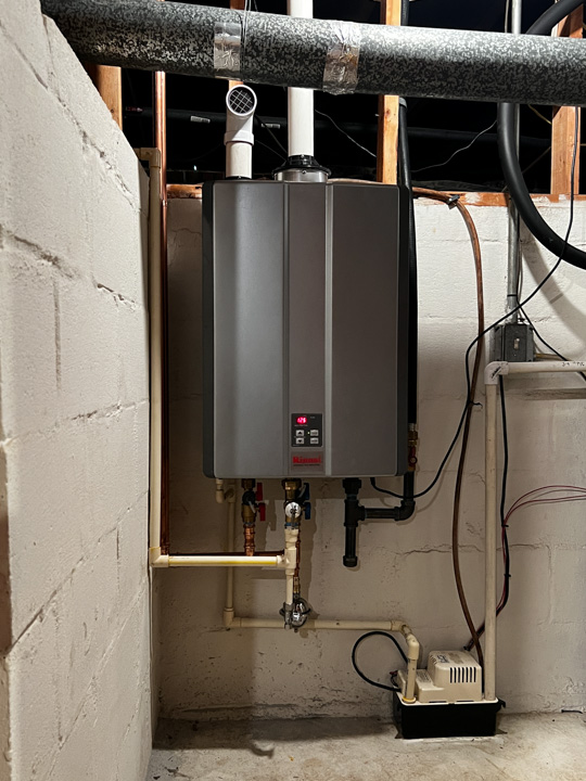 Aaron Services: Plumbing, Heating & Cooling installs a tankless hot water heater for a happy customer in Atlanta, GA