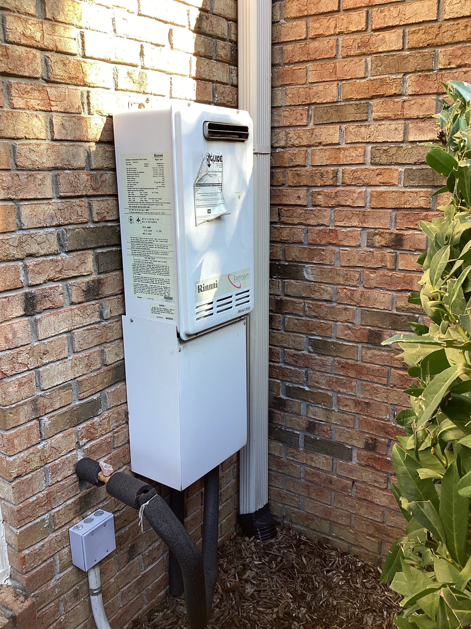 A 20 year old exterior Rinnai tankless that wasn't keeping up with hot water demands