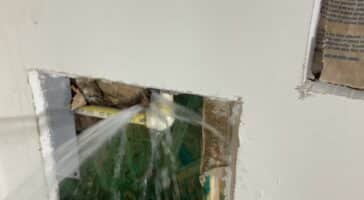 A frozen burst pipe leaking into the home