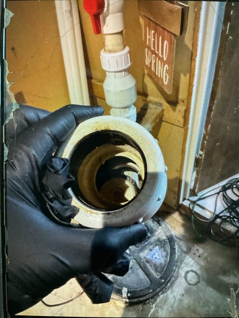 a check valve on a sewage ejector pump system