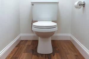 A toilet leaking at base