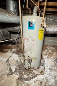 An older water heater that needed a simple fix — homeowners trust Aaron Plumbing for water heater repair Roswell