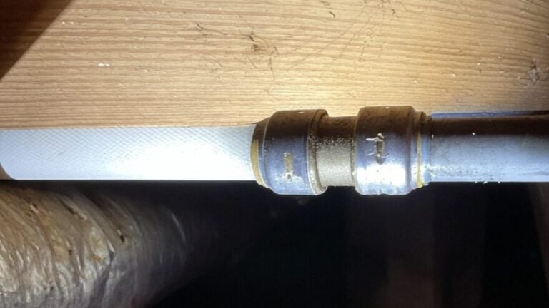 repaired polybutylene pipe coupling temporary fix