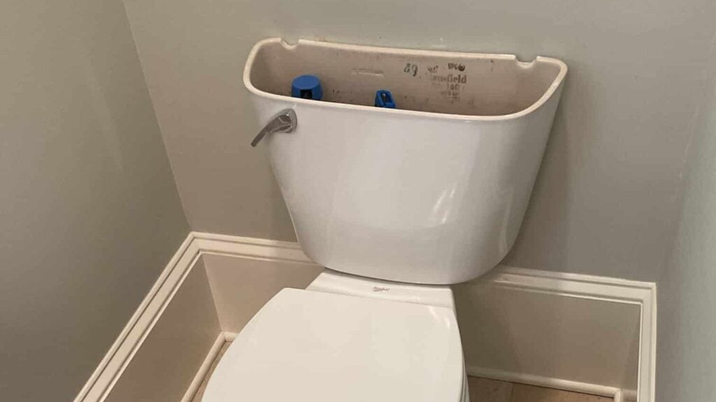 running toilet with lid to tank removed