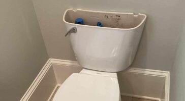 running toilet with lid to tank removed