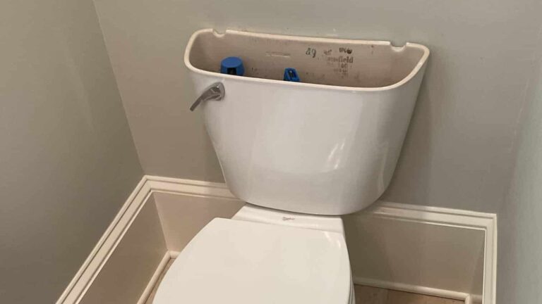 running toilet with lid to tank removed