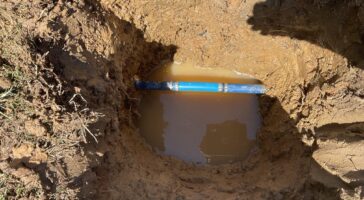 a water line leak revealed by a water meter spinning very slowly