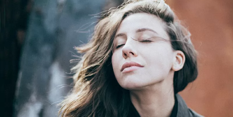 woman breathing fresh air