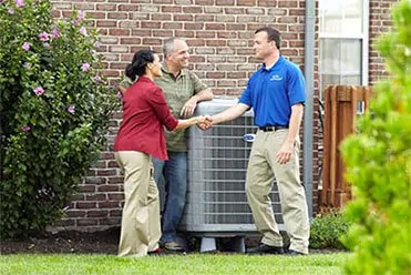HVAC technician talking to the family about HVAC system replacement
